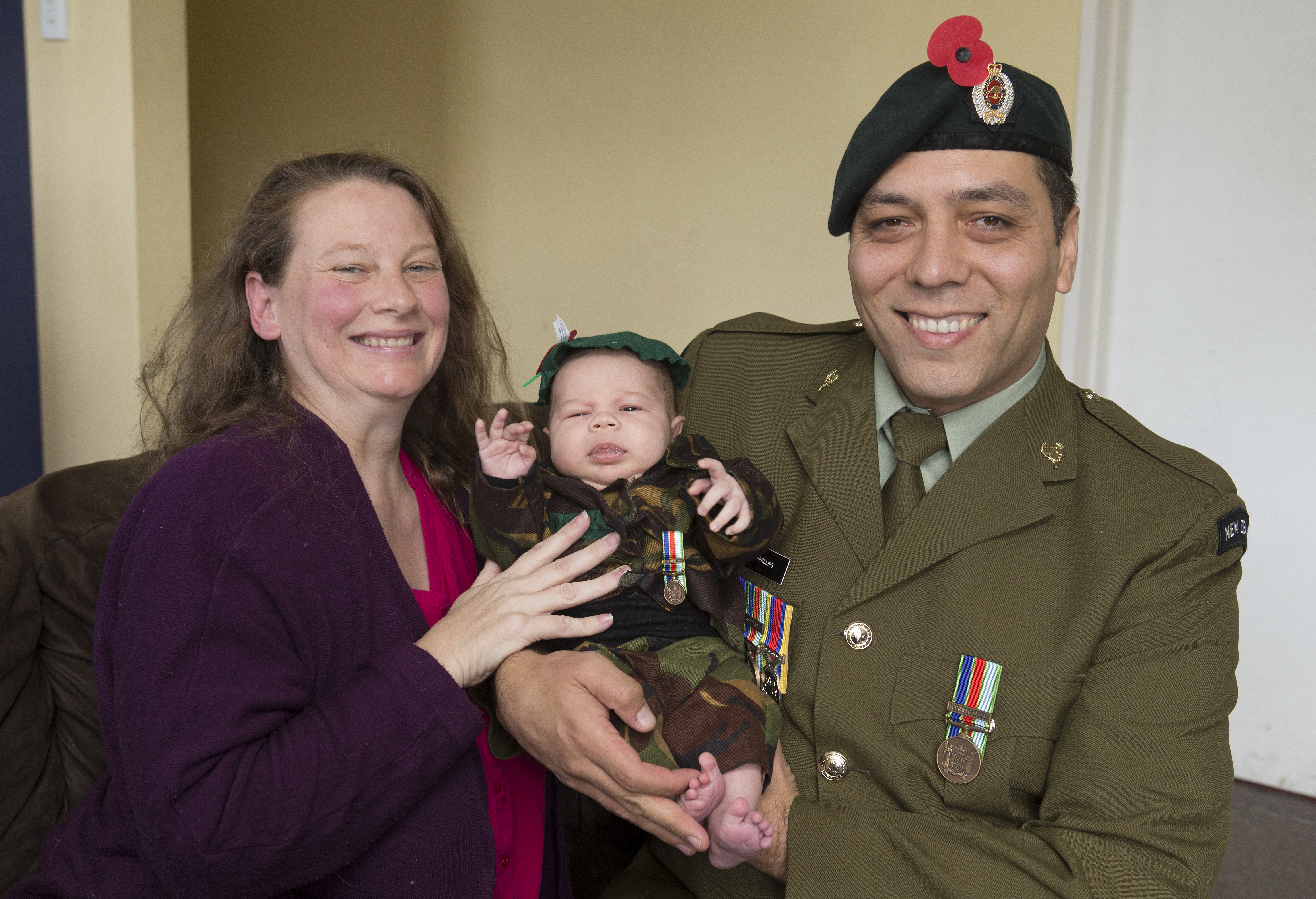 Rawiri Phillips with his mum and dad, Amanda and Tukotahi Phillips. Photo / Mark Mitchell